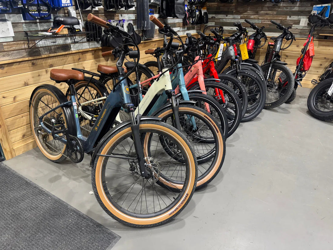A selection of pedal-equipped electric bikes displayed inside the Cyclone Electric Bikes showroom